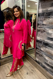 Chic Hot Pink Outfit with Leather Detailing