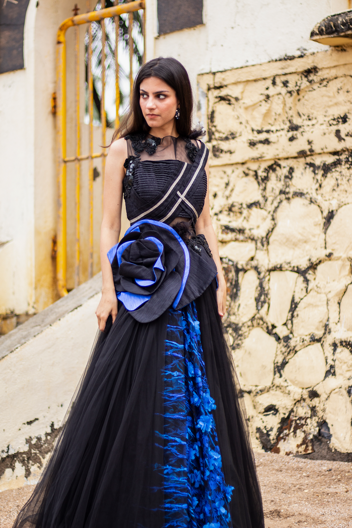 A Man in a Suit and a Woman Wearing a Black Gown while Holding a Bouquet of  Flowers · Free Stock Photo